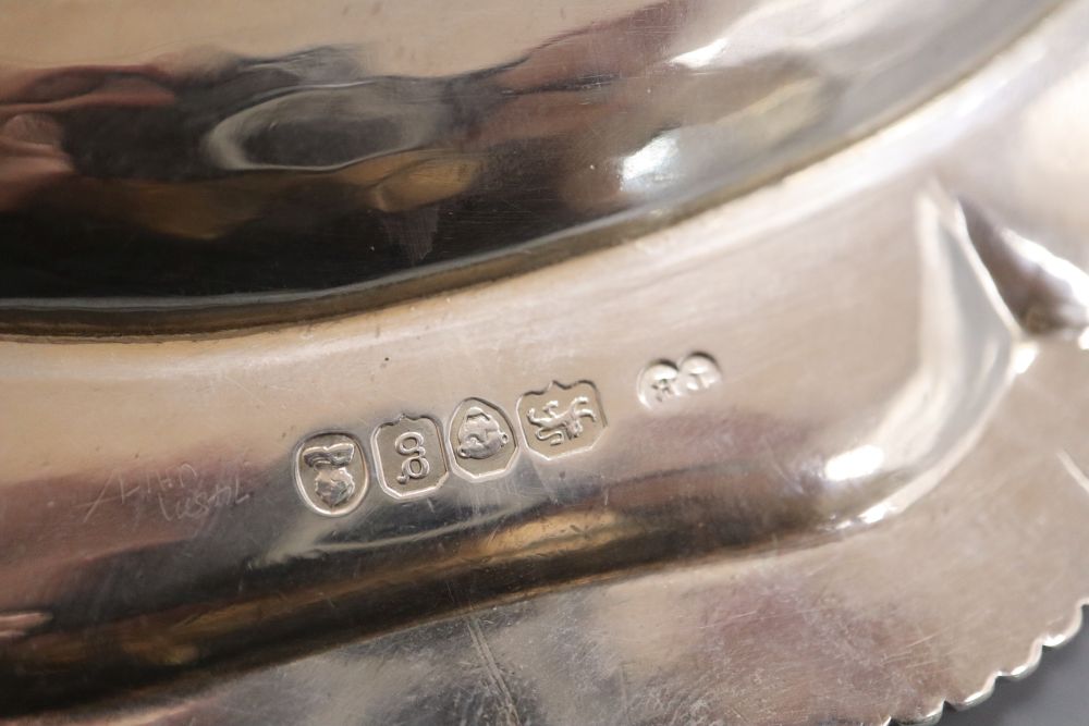 A pair of George IV silver shaped circular dinner plates, with gadrooned borders,